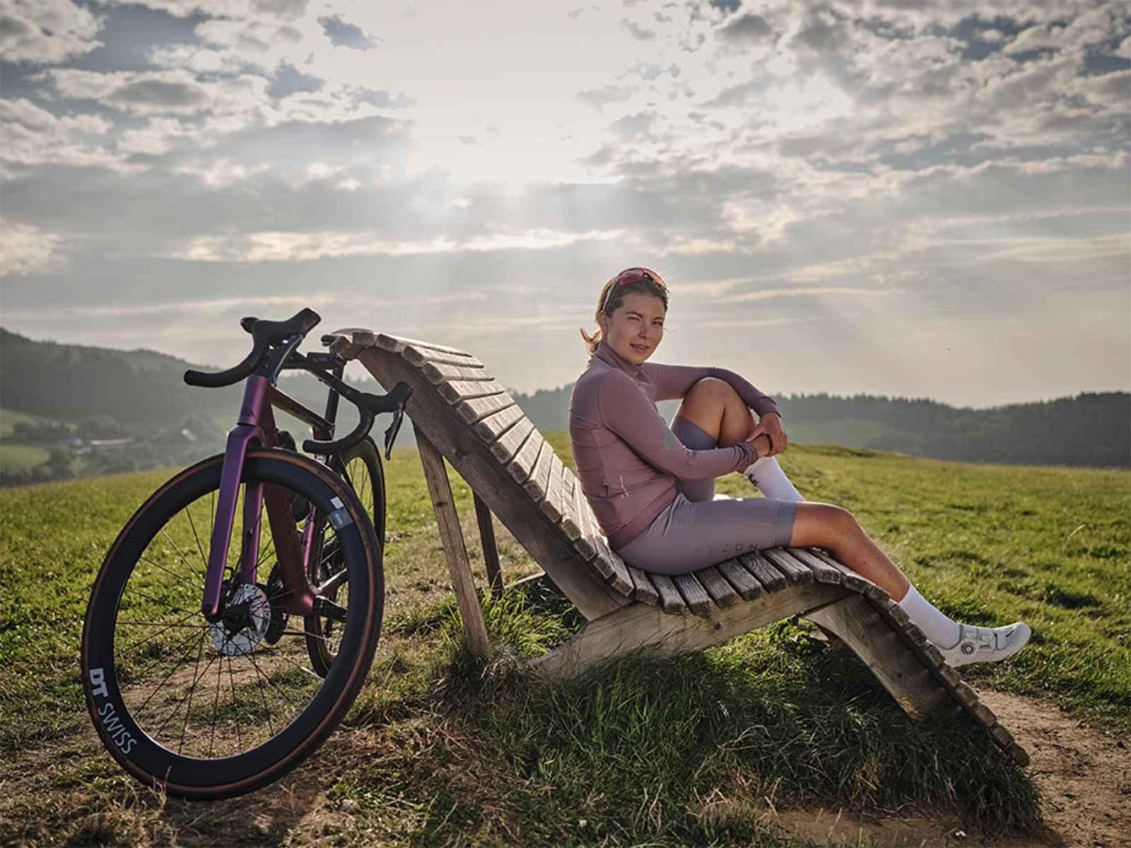 Cyclist pausing at a scenic viewpoint, representing clarity and planning